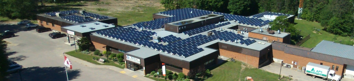 aerial shot of hospital showing solar panels on roof