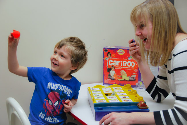 Young boy with speech language therapist