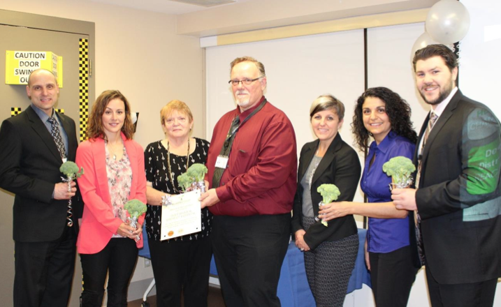 Group of staff accepting award