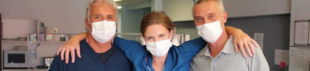 Healthcare worker with xray on computer monitor