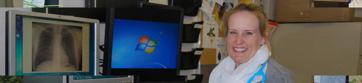 Healthcare worker with xray on computer monitor