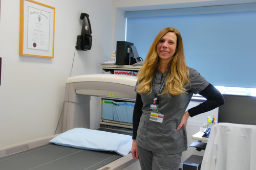Nurse at exam table