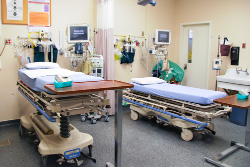 Two patient beds in the emergency room