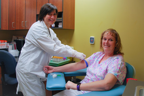 Nurse prepping patient for blood test