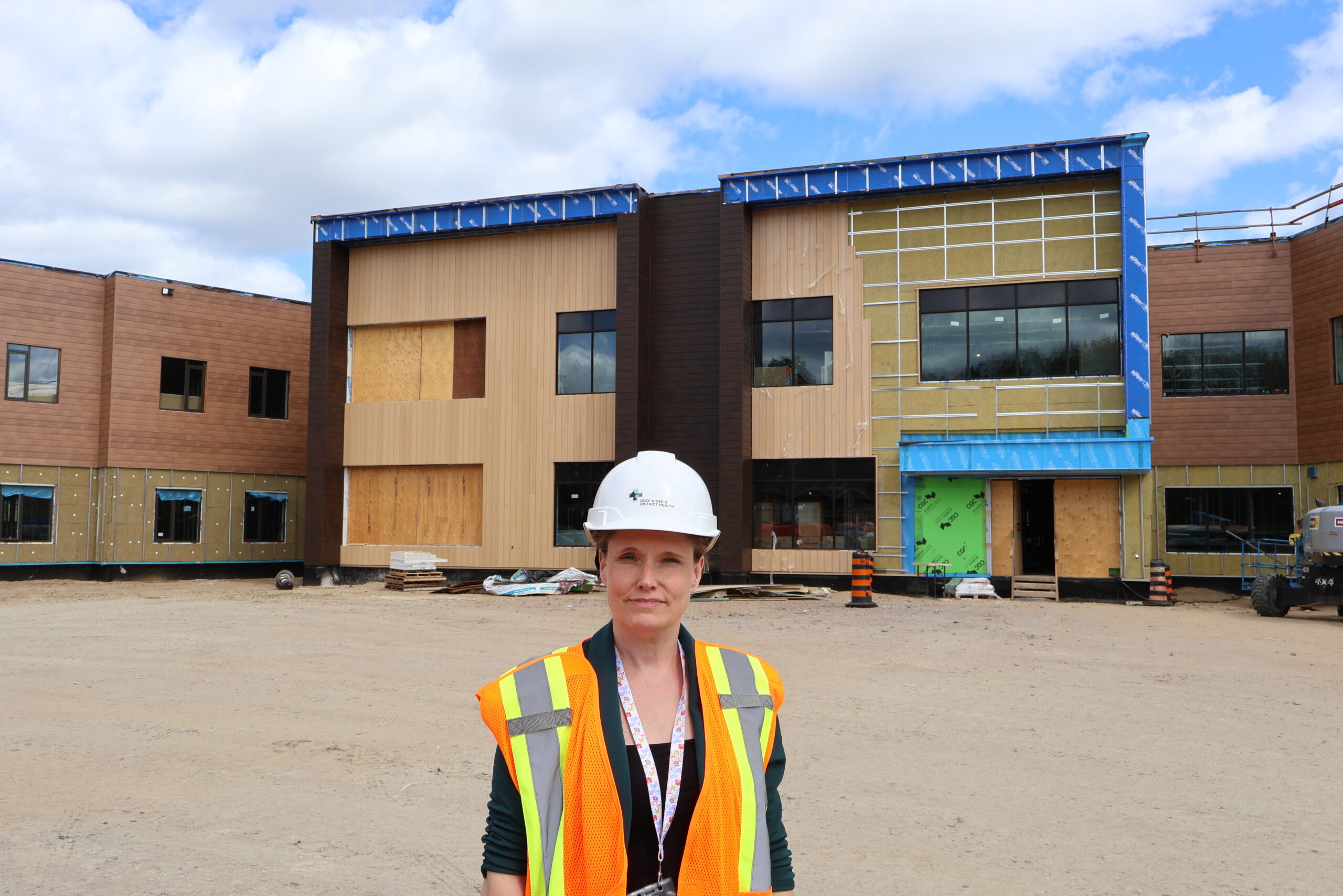 DRDH Foundation Executive Director Megan Jones in front of the new FSL LTC Home.